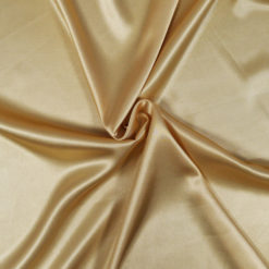 Tissu satin doré